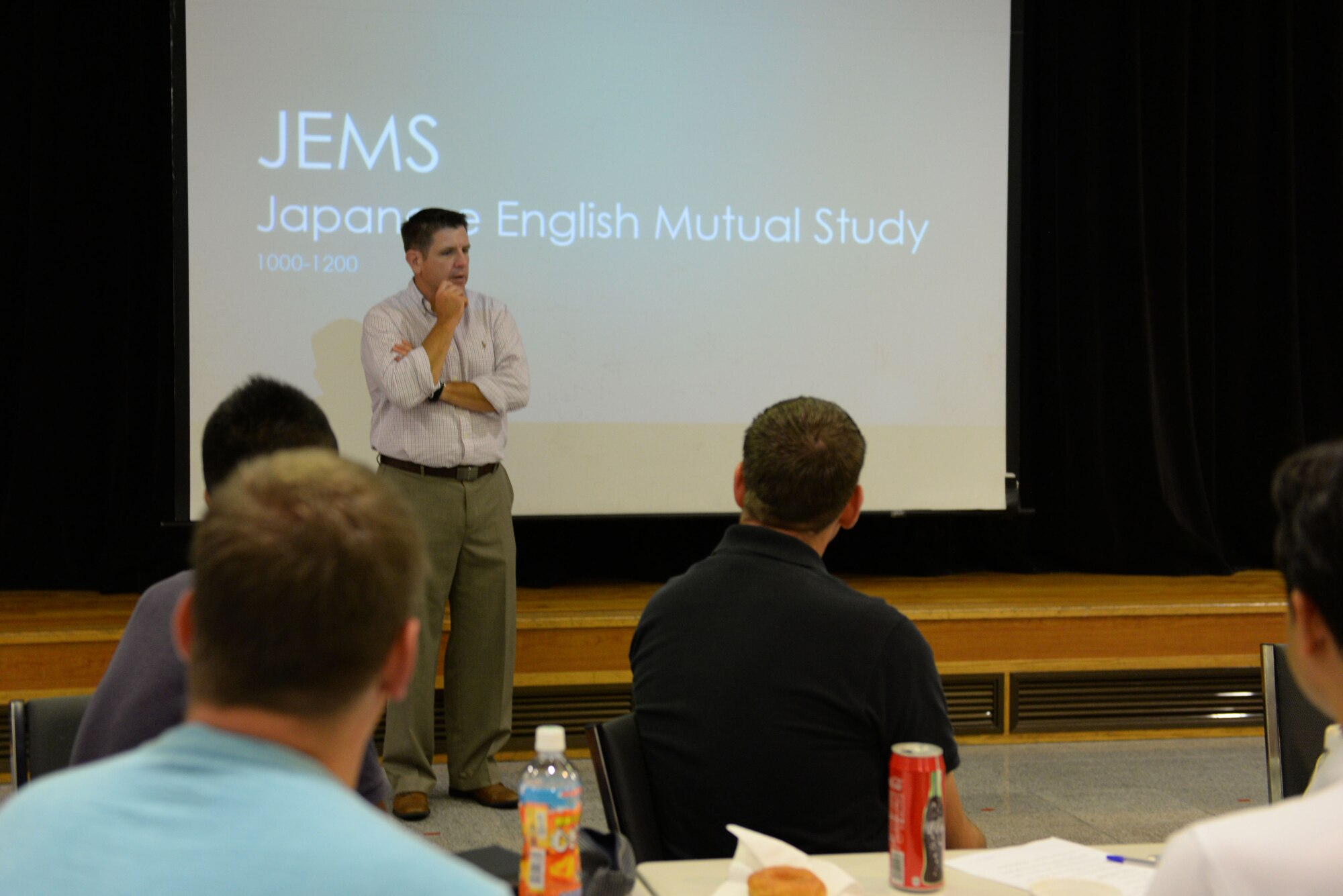 U.S. Air Force Col. Christopher Amrhein, 18th Wing vice commander, speaks to participants about the importance of the Japanese English Mutual Study program on Kadena Air Base, Japan, June 20, 2015. JEMS purpose is to create friendly ties and promote stronger lines of communication between the U.S and Japanese militaries. (U.S. Air Force photo by Senior Airman Omari Bernard)