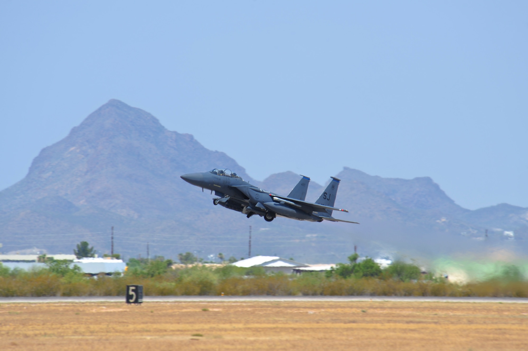 An F-15E Strike Eagle from the 334th Fighter Squadron, Seymour Johnson AFB, N.C., takes off at Davis-Monthan Air Force Base, Ariz., June 22, 2015.  Southern Arizona’s military operating area allowed Strike Eagle pilots to train in unfamiliar terrain with F-35 Lightning IIs, F-16 Fighting Falcons and A-10 Thunderbolt IIs.  (U.S. Air Force photo by Airman 1st Class Chris Massey/Released)