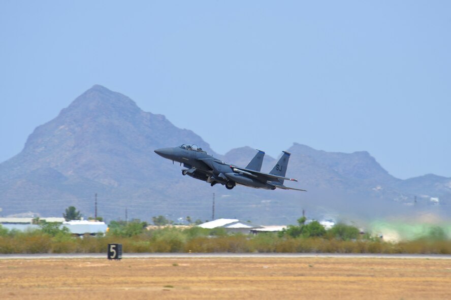 An F-15E Strike Eagle from the 334th Fighter Squadron, Seymour Johnson AFB, N.C., takes off at Davis-Monthan Air Force Base, Ariz., June 22, 2015.  Southern Arizona’s military operating area allowed Strike Eagle pilots to train in unfamiliar terrain with F-35 Lightning IIs, F-16 Fighting Falcons and A-10 Thunderbolt IIs.  (U.S. Air Force photo by Airman 1st Class Chris Massey/Released)