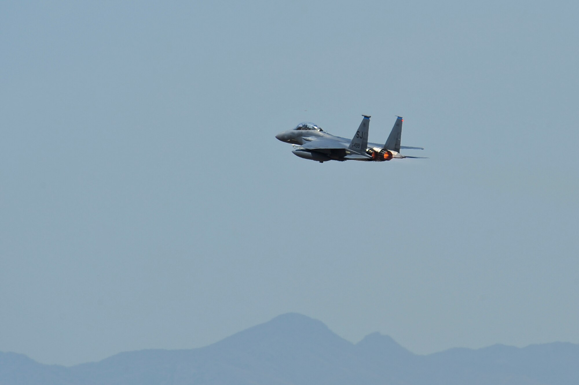 An F-15E Strike Eagle from the 334th Fighter Squadron, Seymour Johnson Air Force Base N.C., takes off from the runway at Davis-Monthan AFB, Ariz., June 22, 2015. Fourteen F-15E Strike Eagles from Seymour Johnson AFB trained with F-35A Lightning IIs, F-16 Fighting Falcons and A-10 Thunderbolt IIs throughout southern Arizona’s military operating areas. (U.S. Air Force photo by Airman 1st Class Chris Massey/Released)