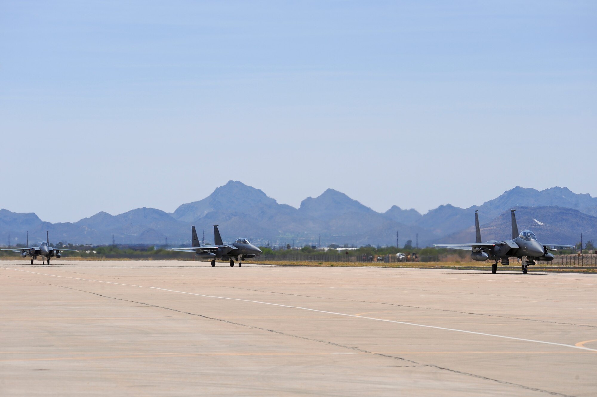 Three F-15E Strike Eagles from the 334th Fighter Squadron, Seymour Johnson Air Force Base, N.C., taxi on the flightline at Davis-Monthan AFB, Ariz., June 19, 2015. Fourteen Strike Eagles from Seymour Johnson AFB trained with F-35A Lightning IIs, F-16 Fighting Falcons and A-10 Thunderbolt IIs throughout southern Arizona’s military operating areas.  (U.S. Air Force photo by Airman 1st Class Chris Massey/Released)