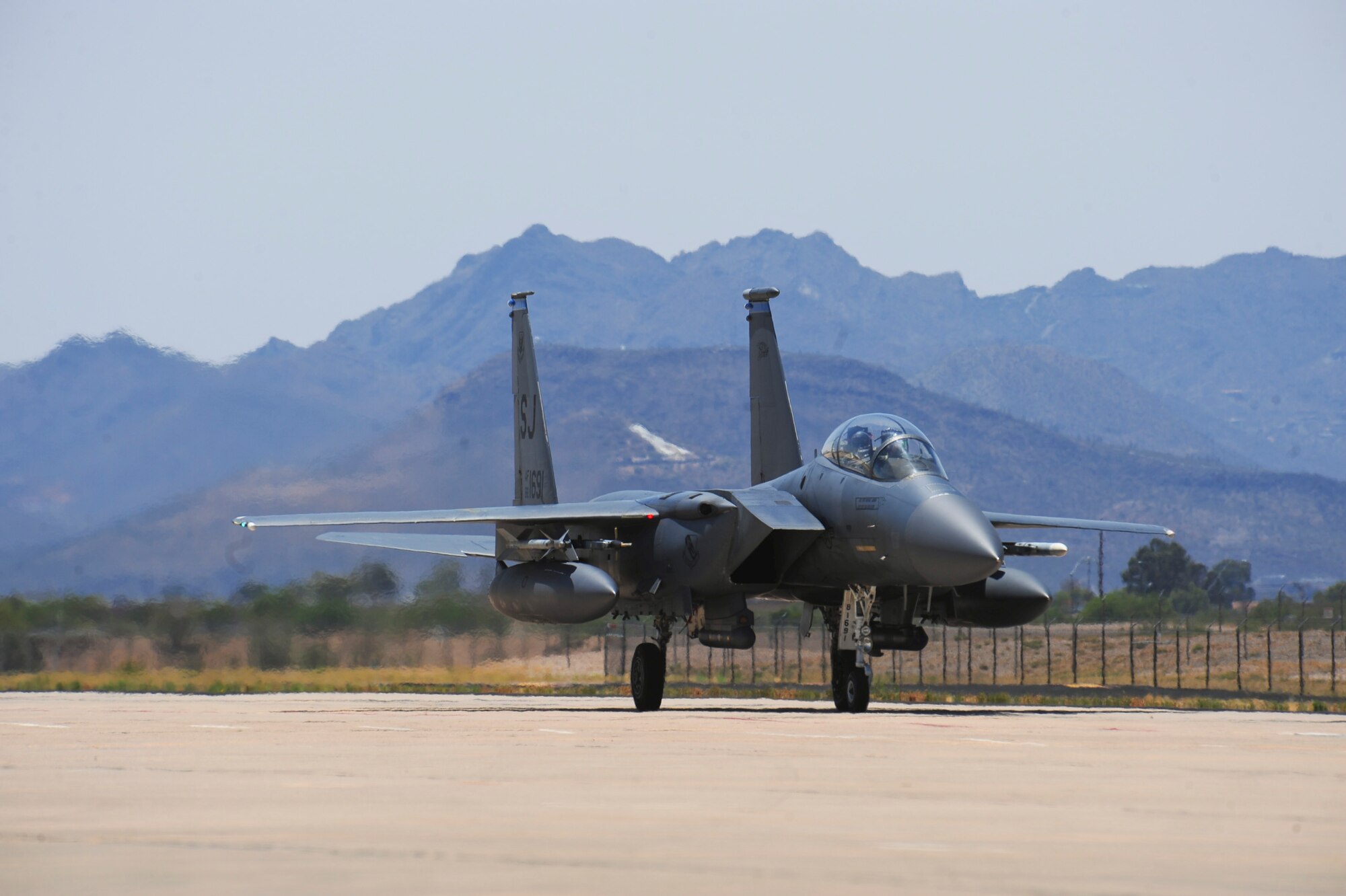 An F-15E Strike Eagle from the 334th Fighter Squadron, Seymour Johnson Air Force Base, N.C., taxis to a ramp at Davis-Monthan AFB, Ariz., June 19, 2015.  Fourteen Strike Eagles will be completing their Surface Attach Tactics phase training in military training areas from June 12-27. (U.S. Air Force photo by Airman 1st Class Chris Massey/Released)