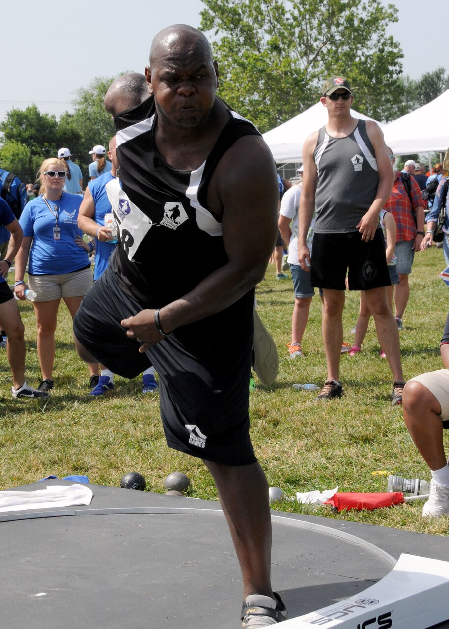 Retired Army Spc. Haywood Range III throws the shot put during the 2015 DoD Warrior Games at Marine Corps Base Quantico, Va., June 23, 2015. Range earned a gold medal in the men's standing 5.0 division. DoD photo by Shannon Collins