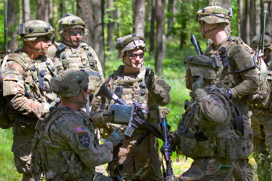 U.S Army 1st Lt. Bryce Heckber, center, briefs his squad leaders during ...