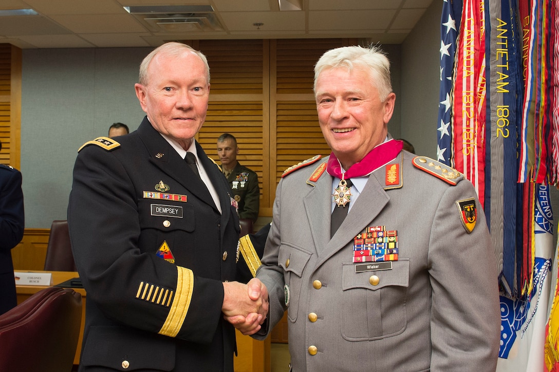 German Army Gen. Volker Wieker, chief of staff for Germany's armed forces, and U.S. Army Gen. Martin E. Dempsey, chairman of the Joint Chiefs of Staff, pose for a photo after Gen. Wieker received a Legion of Merit award at the Pentagon, June 23, 2015. 