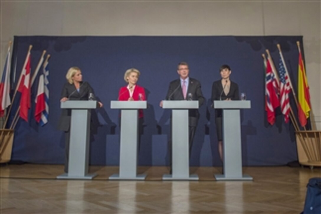 U.S. Defense Secretary Ash Carter speaks during a combined news conference with Dutch Defense Minister Jeanine Hennis-Plasschaert, left, German Defense Minister Ursula von der Leyen, second from left, and Norwegian Defense Minister Ine Marie Eriksen Soreide at 1 German Netherlands Corps, a multinational high readiness corps headquarters based in Munster, Germany, June 22, 2015. Carter is in Europe to hold bilateral and multilateral meetings with European defense ministers and to participate in his first NATO ministerial as defense secretary.