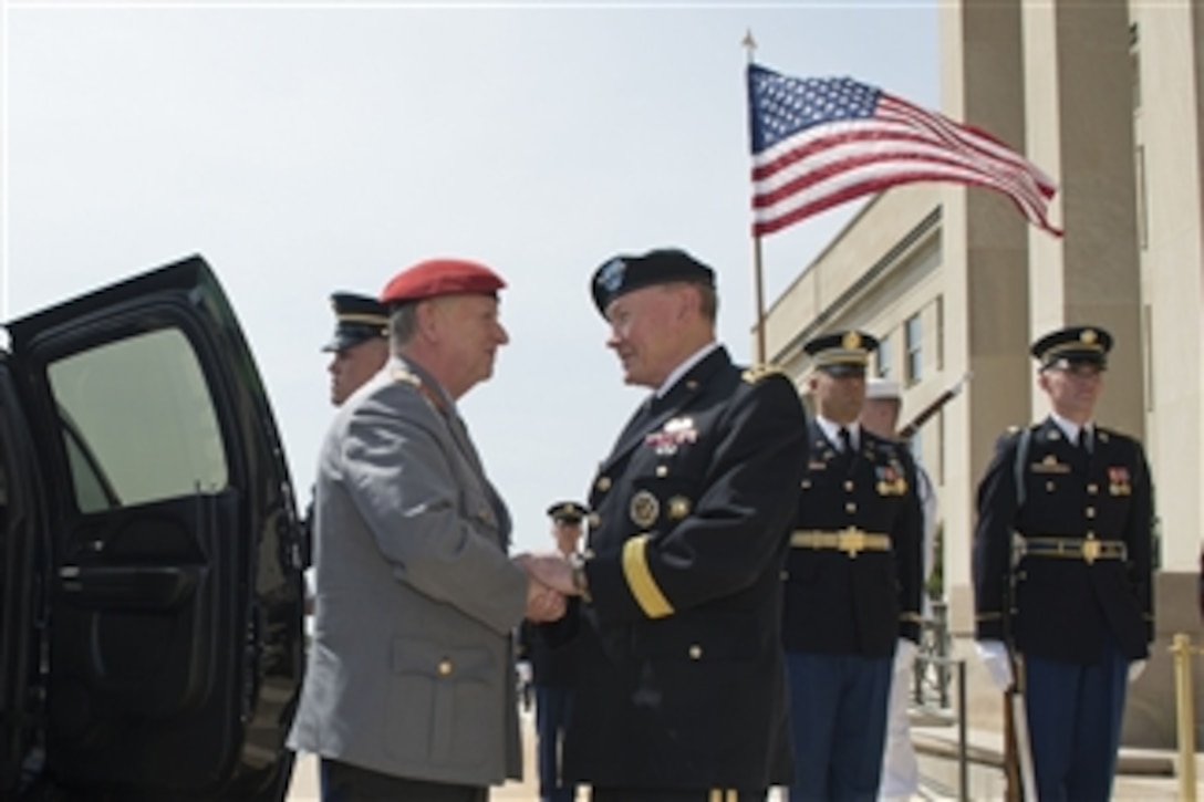 U.S. Army Gen. Martin E. Dempsey, chairman of the Joint Chiefs of Staff, welcomes German Army Gen. Volker Wieker, chief of staff for Germany's armed forces, to the Pentagon, June 23, 2015. The two leaders met to discuss matters of mutual importance.