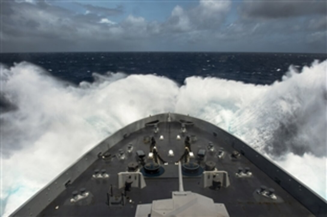 The amphibious transport dock ship USS Anchorage travels through waves in the Indian Ocean, June 22, 2015. The Anchorage, part of the Essex Amphibious Ready Group, is supporting maritime security operations and theater security cooperation efforts in the U.S. 5th Fleet area of responsibility. 

