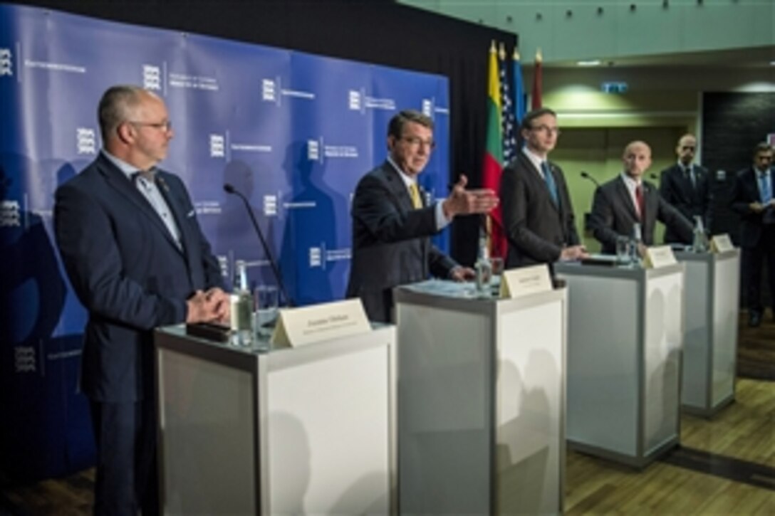 U.S. Defense Secretary Ash Carter, second from left, participates in a combined press conference with Lithuanian Defense Minister Juozas Olekas, far left, Estonian Defense Minister Sven Mikser, third from left, and Latvian Defense Secretary Janis Sarts in Tallinn, Estonia, June 23, 2015. Carter is in Europe to meet with European defense ministers and participate in his first NATO ministerial as defense secretary.