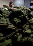 Army Sgt. Frank, an infantryman in Company A, 1st Battalion, 151st Infantry
Regiment of the Indiana National Guard, counts life jackets at an armory
April 25, 2011, during the National Guard's response to flooding in the
area. The 151st Infantry and several other units amounting to approximately
250 Soldiers were mobilized to state active duty in response to the flooding
in Gibson, Knox, Daviess and Posey counties due to near record numbers of
rainfall. Soldiers are assisting in sandbagging operations, transporting displaced civilians to shelters, search and rescue missions, debris removal and damage
assessment.