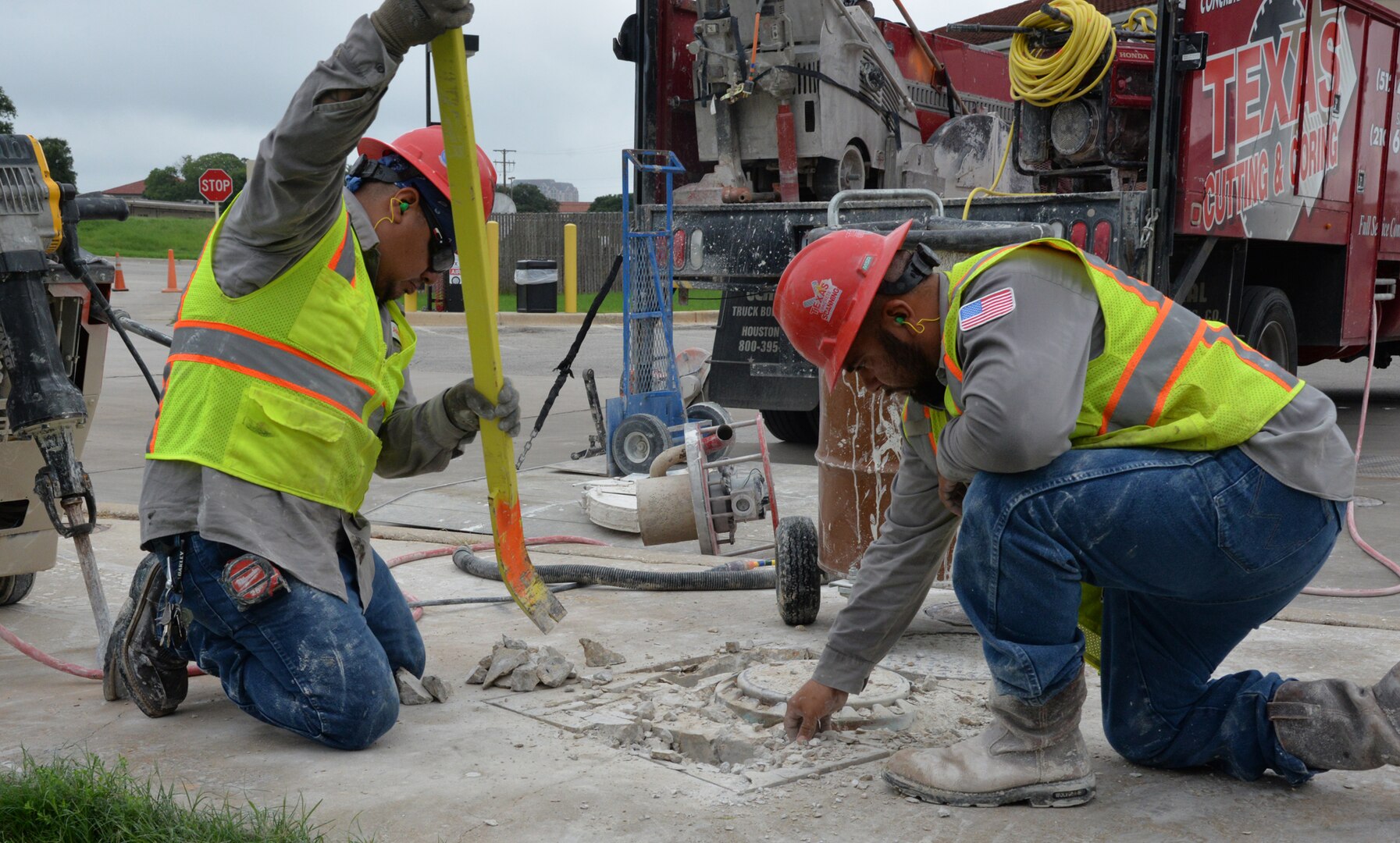 Workmen begin repairs by removing the concrete around the underground fuel storage systems at the Walters Street Army & Air Force Exchange Service Gas Station, building 331, near the Walters Street 