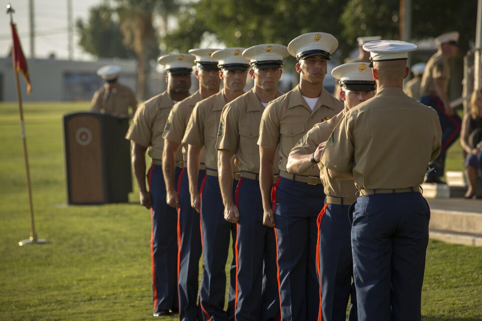 Marines with 2nd Battalion, 7th Marine Regiment, perform the passing of the colors presentation during the reciting of "Old Glory" as part of the battalion's relief and appointment ceremony at Lance Cpl. Torrey L. Gray Field, June 19, 2015. During the presentation, the flag was passed between Marines of every rank retiring Sgt. Maj. Fredrick A. Smith, outgoing battalion sergeant major, 2/7, has held throughout his career. (Official Marine Corps photo by Pfc. Levi Schultz/Released)