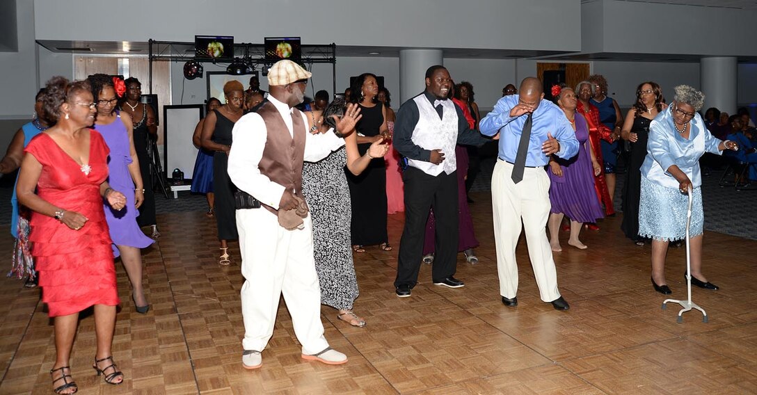 Marines from Marine Corps Logistics Base Albany and Marine Corps Logistics Command participate in the 12th annual Senior Citizens Prom held at the Albany James H. Gray Sr. Civic Center, June 19.  
The event was hosted by the Albany Recreation and Parks Department for area seniors as a way for them to enjoy themselves in a safe environment with their peers. "They look forward to this event every year and they love seeing the Marines and police officers who volunteer their time to escort and dance with them," Tee Taylor, program coordinator, said. "We miss the Marines in their uniforms this year, but they still look good and you can still tell they are Marines."
