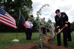 Army Maj. Gen. Darren Owens, special assistant to the director, Army
National Guard, helps plant a tree symbolizing cooperation between Afghan government officials and National Guard Agricultural Development Teams during a
ceremony at the National Arboretum in Washington, D.C