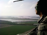 Army Col. Wendul Hagler, task force commander of Operation Rising Tide and commander of the 70th Troop Command, Jefferson Barracks, assesses flood conditions in southeast Missouri on April 27, 2011