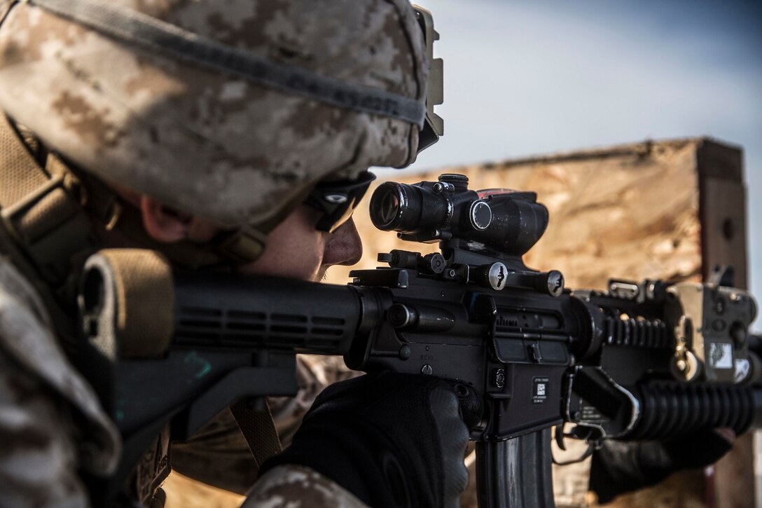 U.S. Marine Cpl. Justin Saalfeld fires at his target during a short-range marksmanship qualification course aboard the USS Rushmore (LSD 47) at sea in the Indian Ocean, June 18, 2015. Saalfeld is a assaultman with Kilo Company, Battalion Landing Team 3rd Battalion, 1st Marine Regiment, 15th Marine Expeditionary Unit. The marksmanship course improves Marine’s combat shooting tactics and prepares them for future operations while deployed with the 15th MEU. (U.S. Marine Corps photo by Sgt. Emmanuel Ramos/Released)