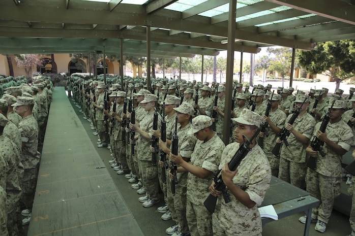 Recruits of Golf Company, 2nd Recruit Training Battalion, stand with their issued M16-A4 Service Rifles during rifle issue at Marine Corps Recruit Depot San Diego, Calif., June 22. Recruits and their rifles will become inseparable and function as one throughout the remainder of recruit training. Today, all males recruited west of the Mississippi are trained at MCRD San Diego. The depot is responsible for training more than 16,000 recruits annually. Golf Company is scheduled to graduate from recruit training on September 11.
