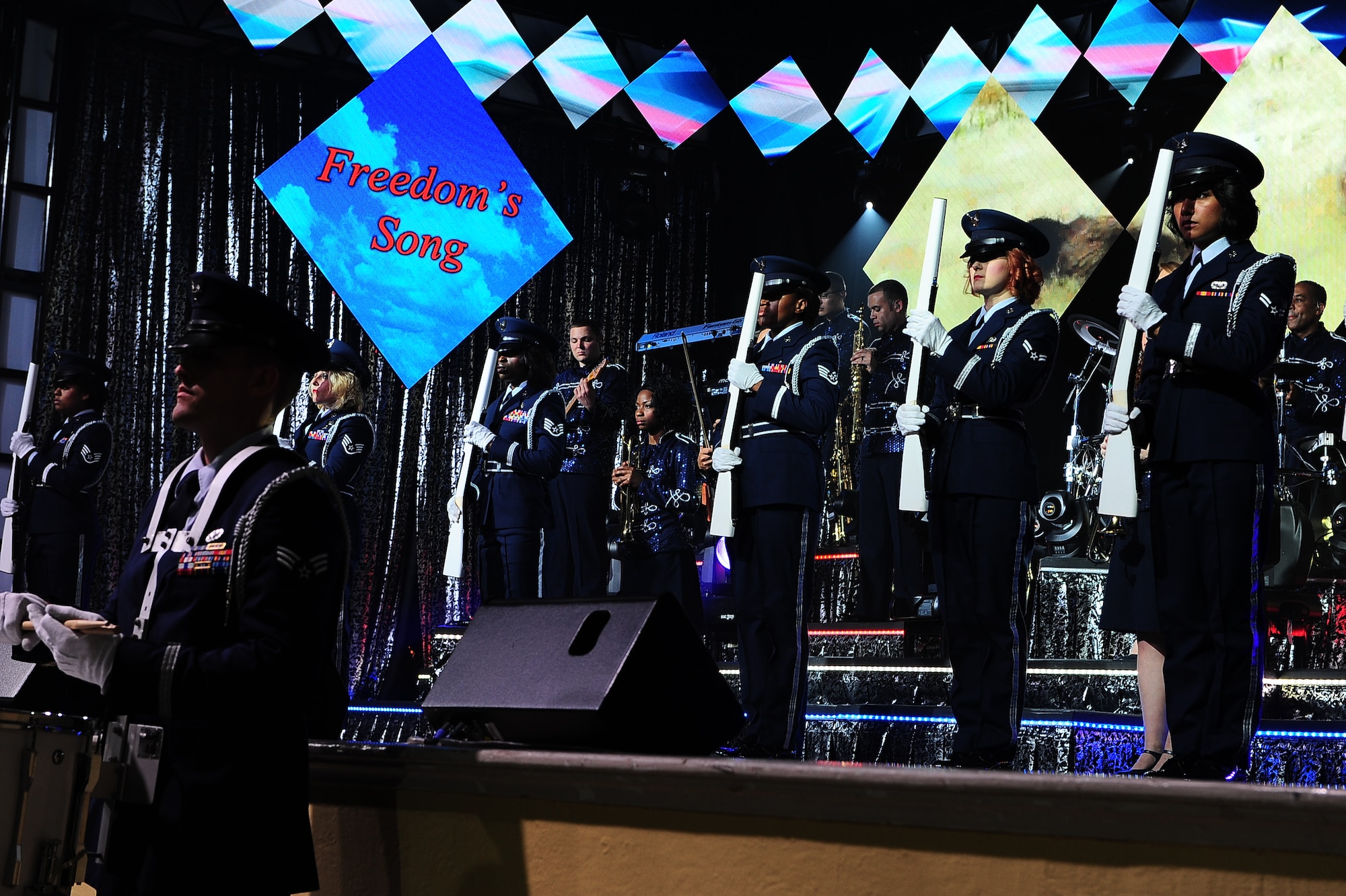 Airmen in the 2015 Tops in Blue world tour post the colors and introduce this year’s tour title, "Freedom’s Song," June 20 at Mississippi University for Women's Whitfield Hall Rent Auditorium in Columbus, Mississippi. The show combined a wide range of music, both vocal and instrumental, and dancing. (U.S. Air Force photo/Airman 1st Class John Day)