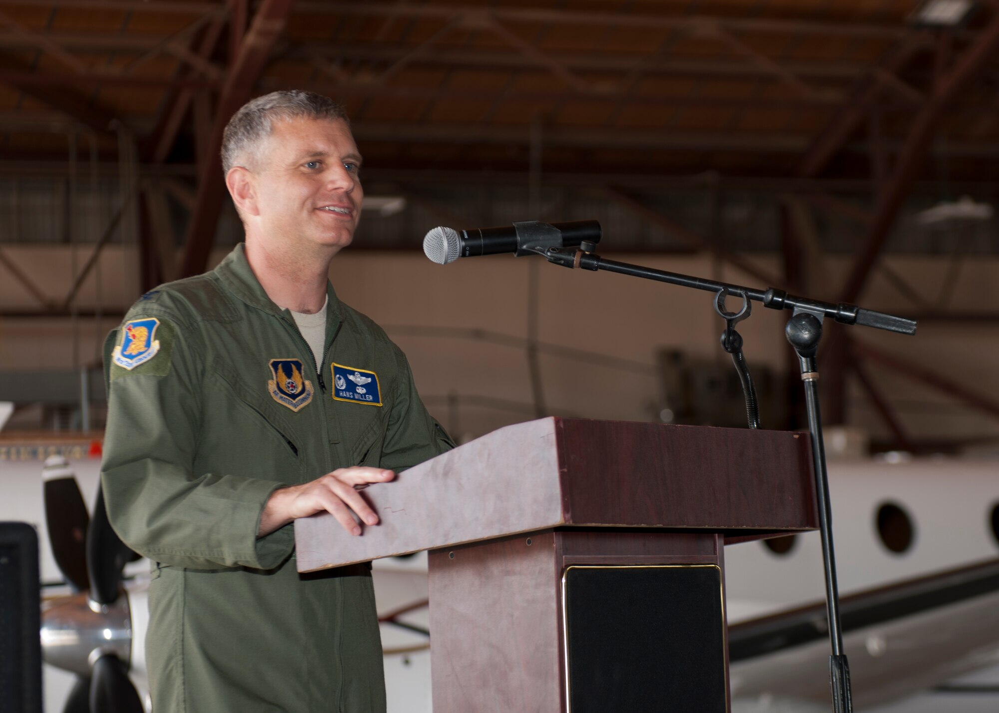 Colonel Hans Miller, 96th Test Group commander addresses the crowd at the 586th Flight Test Squadron Change of Command at Holloman Air Force Base, N.M., June 24, 2015. Miller was the presiding officer for the ceremony that saw Lt. Col. Steven Ross relinquish command of the 586th FLTS to Lt. Col. Nathan Diller. Miller spoke about the accomplishments of the 586th FLTS under the leadership of Ross and the excitement of Diller taking over command. (U.S. Air Force photo by Staff Sgt. Joe Laws / Released)