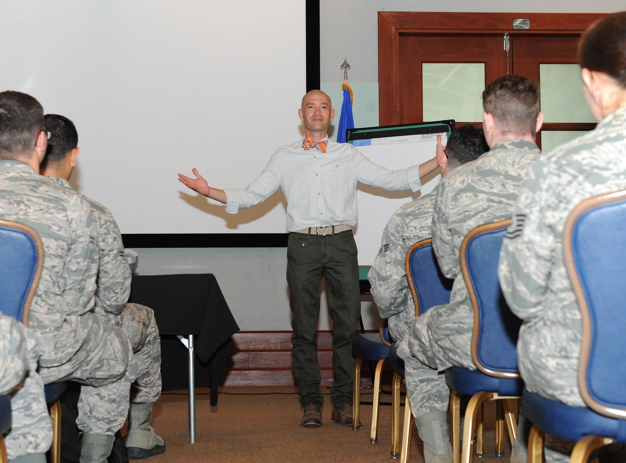 Brad Fuller, owner and operator of a Chick-fil-A franchise in Wichita, Kan., speaks to members of Team McConnell during #theSUMof15 at the Robert J. Dole Center, June 24, 2015, here. #theSUMof15 is a professional development series that began May 27 and is scheduled to continue through Sept. 2. During this time, McConnell will host 15 guest speakers who will discuss the topics of career progression, what has made them successful and what has gotten them to the position they hold. “I love developing leaders,” said Fuller. “That’s my passion. Everybody has an opportunity to lead if they are confident and understand what leadership is.” (U.S. Air Force photo by Senior Airman David Bernal Del Agua)