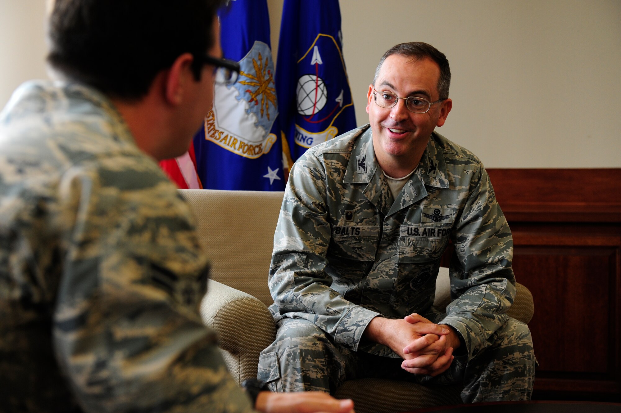 Col. Keith Balts, 30th Space Wing commander, is interviewed by Airman 1st Class Robert Volio, 30th Space Wing photojournalist, Vandenberg Air Force Base, Calif. Balts' upcoming change of command will introduce Col. Christopher Moss as the fifteenth 30th Space Wing commander. (U.S. Air Force photo by Staff Sgt. Jim Araos/Released)