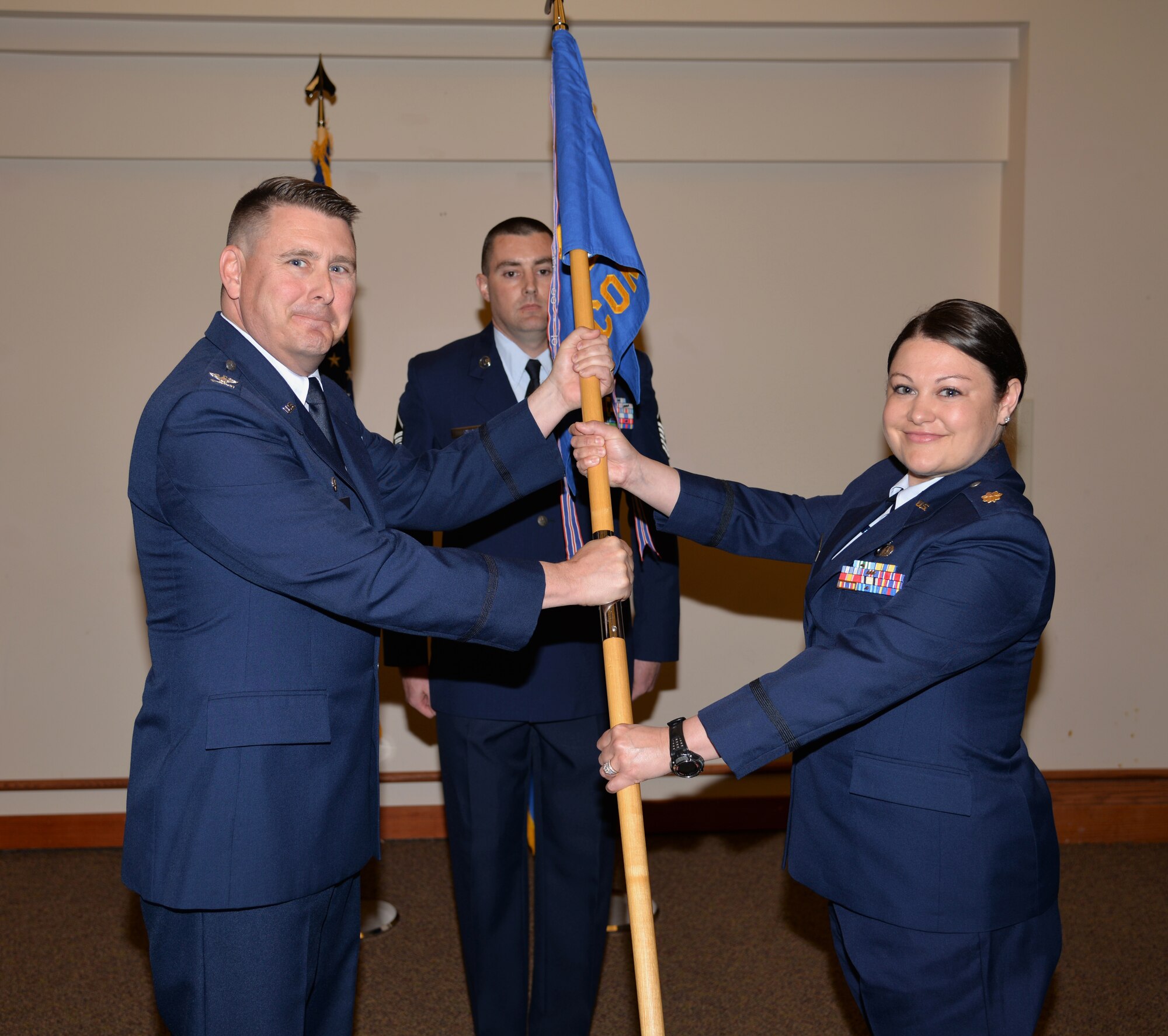Col. Larry Rice, the 354th Mission Support Group commander, presides over the 354th Contracting Squadron change of command ceremony June 11, 2015, Eielson Air Force Base, Alaska. Maj. David Hatton relinquishes command to Maj. Danielle Bowers. (U.S. Air Force photo by Staff Sgt. Kirsten Wicker/Released)
