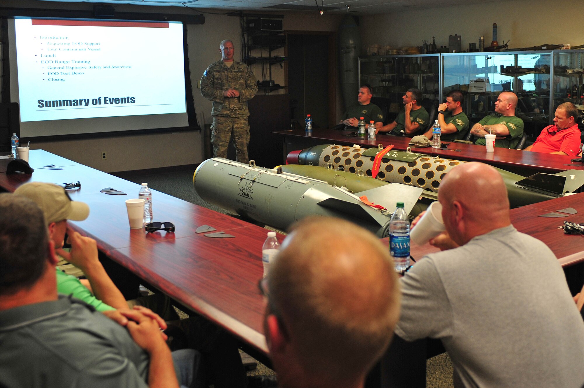 Master Sgt. Tracy Passerotti, 4th Civil Engineer Squadron explosive ordnance disposal flight NCO in charge, provides an overview of events for members of the Wayne County Sheriff’s Office as part of a joint training exercise, June 17, 2015, at Seymour Johnson Air Force Base, North Carolina. The talk informed members of the WCSO what EOD’s capabilities are and how to request their assistance. (U.S. Air Force photo/Senior Airman John Nieves Camacho)