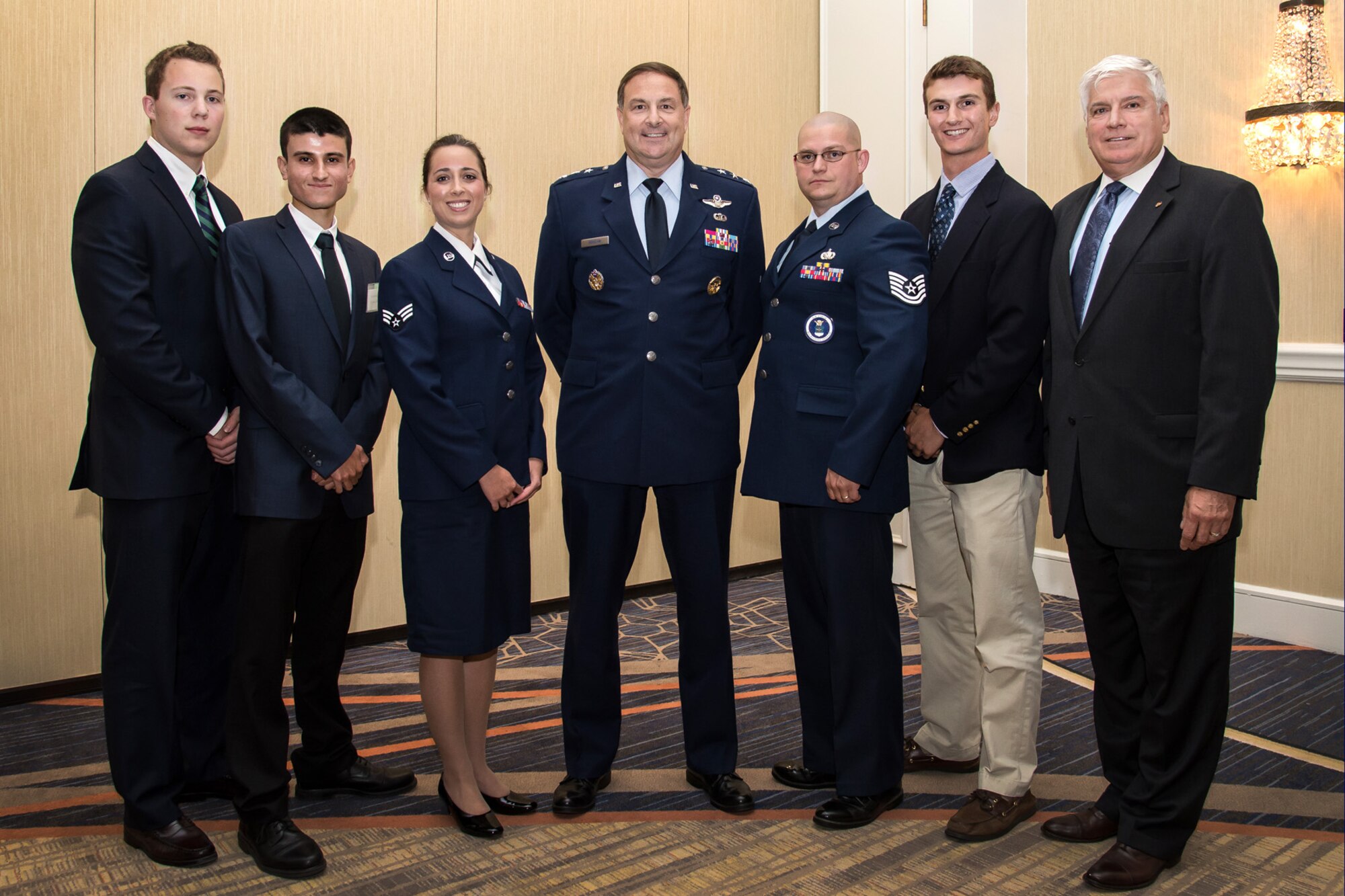 Lt. Gen. Christopher C. Bogdan,  program executive officer for the F-35 Lightning II Joint Program Office, poses for a photo with Paul Zauner (far right), Air Force Association Paul Revere Chapter president, and scholarship recipients during the AFA Chief of Staff Scholarship Dinner in Burlington, Mass., June 17. Awarded scholarships were: Samuel Pridotkas, $3,000; Nicholas Giurleo, $5,000; Senior Airman Ashley E. Petrolini, 66th Medical Squadron medical logistics technician, $1,000; Tech. Sgt. Orville Toller, 319th Recruiting Squadron operations NCO, $1,000; and Stephen Brao, $2,000. (U.S. Air Force photo by Walter Santos)