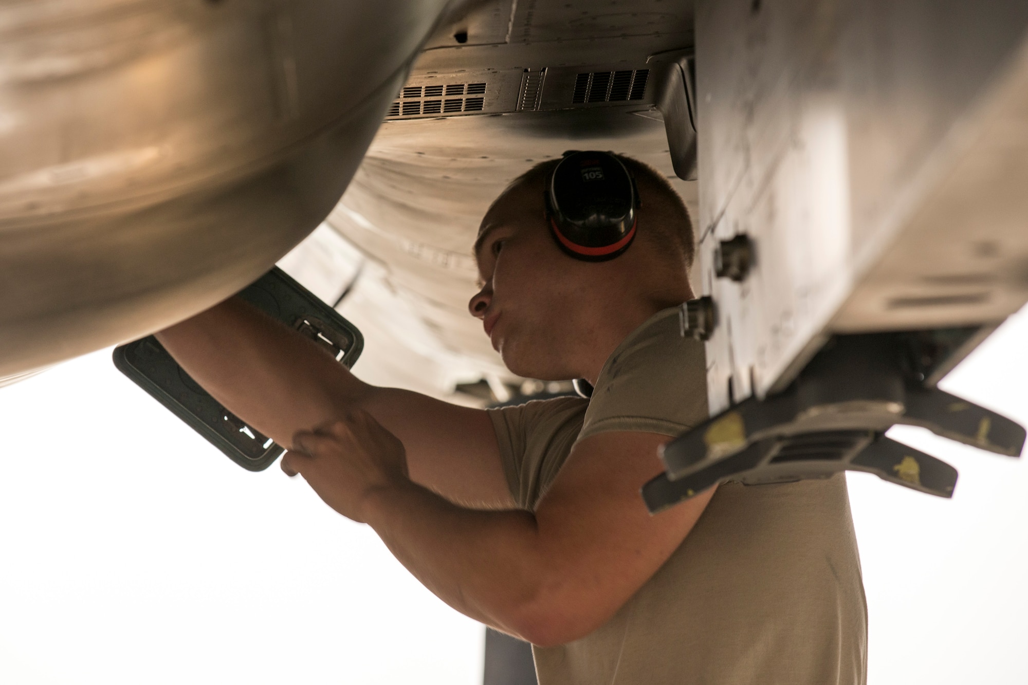 U.S. Air Force Senior Airman Jonathan Mashburn, a 4th Fighter Wing weapons loader, inspects an F-15E Strike Eagle aircraft assigned to the 4th Fighter Wing, Seymour Johnson Air Force Base, N.C., as a part of an end of runway inspection June 23, 2015, during the Northern Edge 2015 exercise at Eielson Air Force Base, Alaska. End of runway inspections allow weapons loaders to ensure the serviceability of on-board weapons prior to takeoff. (U.S. Air Force photo by 1st Lt. Elias Zani/Released)