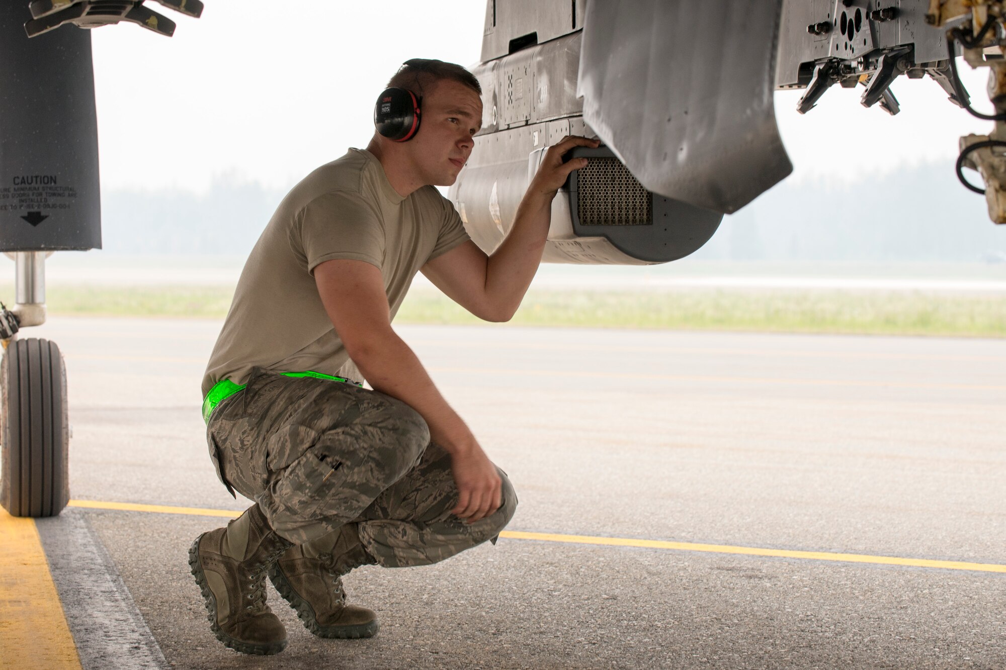 U.S. Air Force Senior Airman Jonathan Mashburn, a 4th Fighter Wing weapons loader, inspects an F-15E Strike Eagle aircraft assigned to the 4th Fighter Wing, Seymour Johnson Air Force Base, N.C., as a part of an end of runway inspection June 23, 2015, during the Northern Edge 2015 exercise at Eielson Air Force Base, Alaska. End of runway inspections allow weapons loaders to ensure the serviceability of on-board weapons prior to takeoff. (U.S. Air Force photo by 1st Lt. Elias Zani/Released)