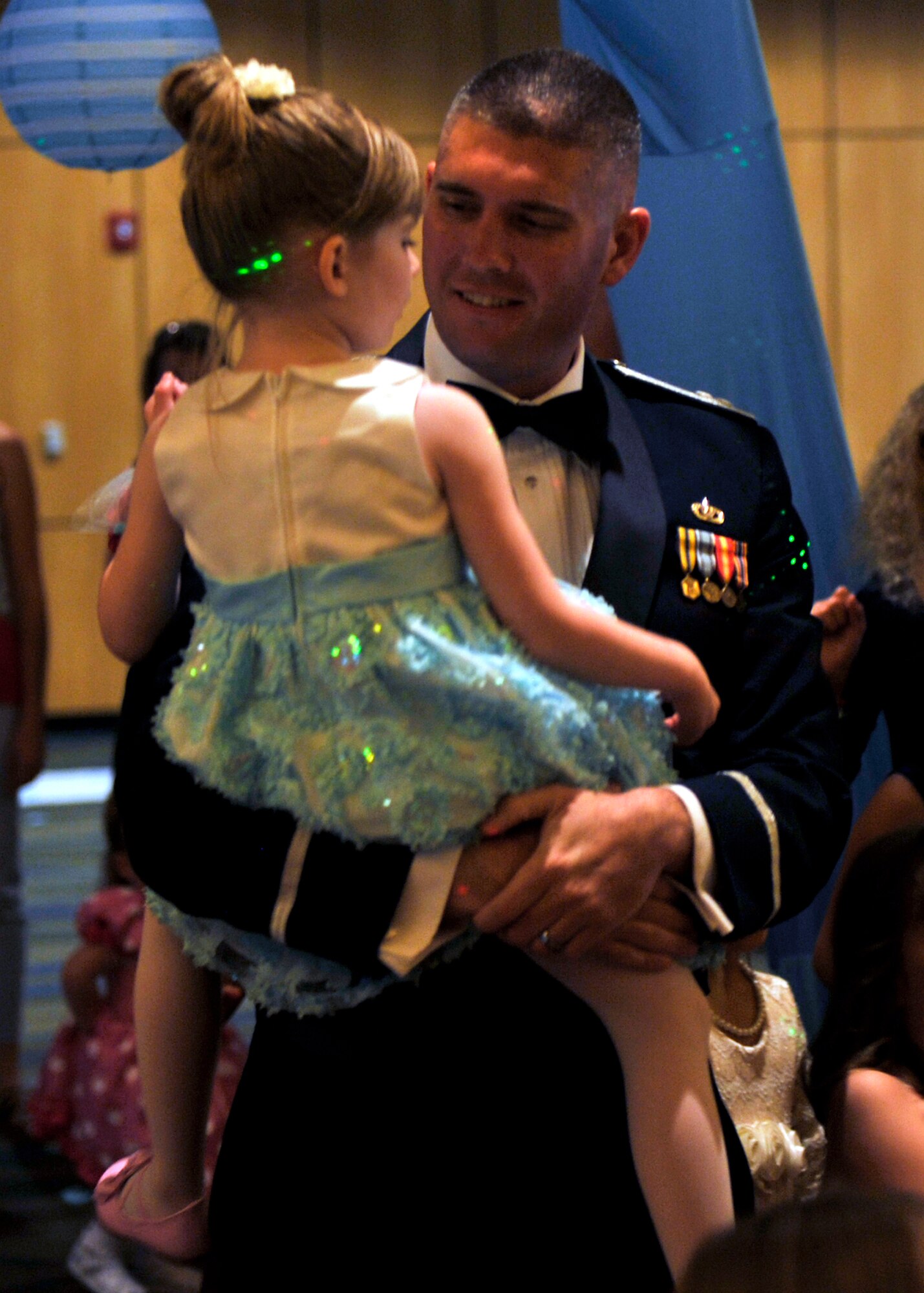 Captain Jeffery Andrieu, Continental U.S. North American Aerospace Defense Command Region-1st Air Force (Air Forces Northern) A7 operations chief, dances with his daughter “Cinderella” June 18 during the Daddy Daughter Dance at the Horizons center. Every year, the 325th Force Support Squadron hosts the event right before Father’s Day so fathers can enjoy time with their daughters. (U.S. Air Force Photo by Airman 1st Class Sergio A. Gamboa/Released)