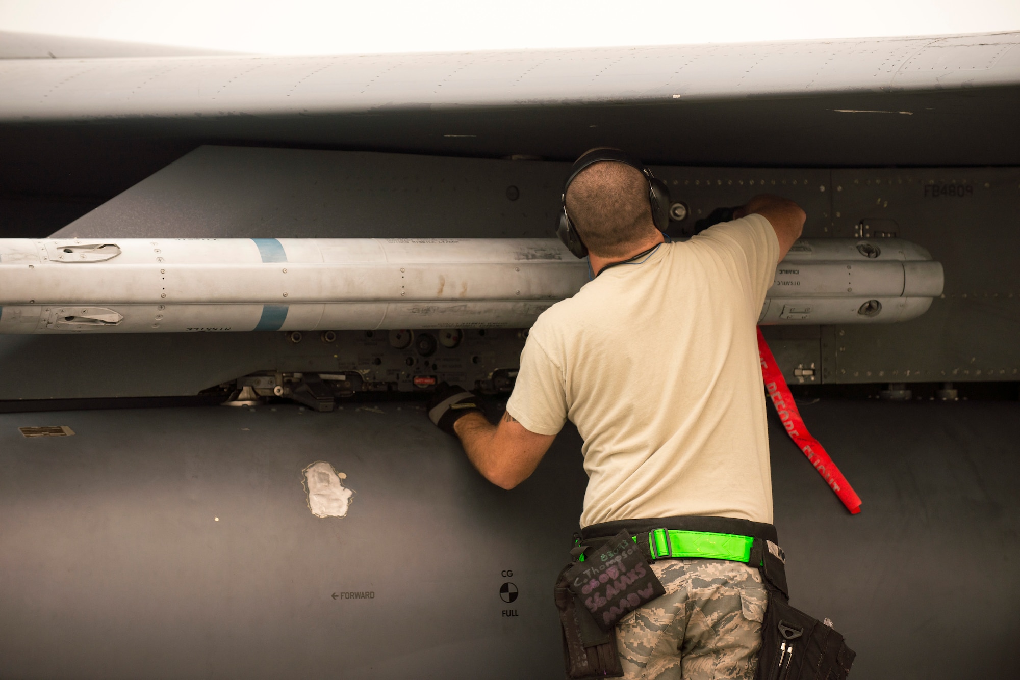 U.S. Air Force Staff Sgt. Chris Thompson, a 4th Fighter Wing weapons loader, inspects an F-15E Strike Eagle aircraft assigned to the 4th Fighter Wing, Seymour Johnson Air Force Base, N.C., as a part of an end of runway inspection June 23, 2015, during the Northern Edge 2015 exercise at Eielson Air Force Base, Alaska. End of runway inspections allow weapons loaders to ensure the serviceability of on-board weapons prior to takeoff. (U.S. Air Force photo by 1st Lt. Elias Zani/Released)
