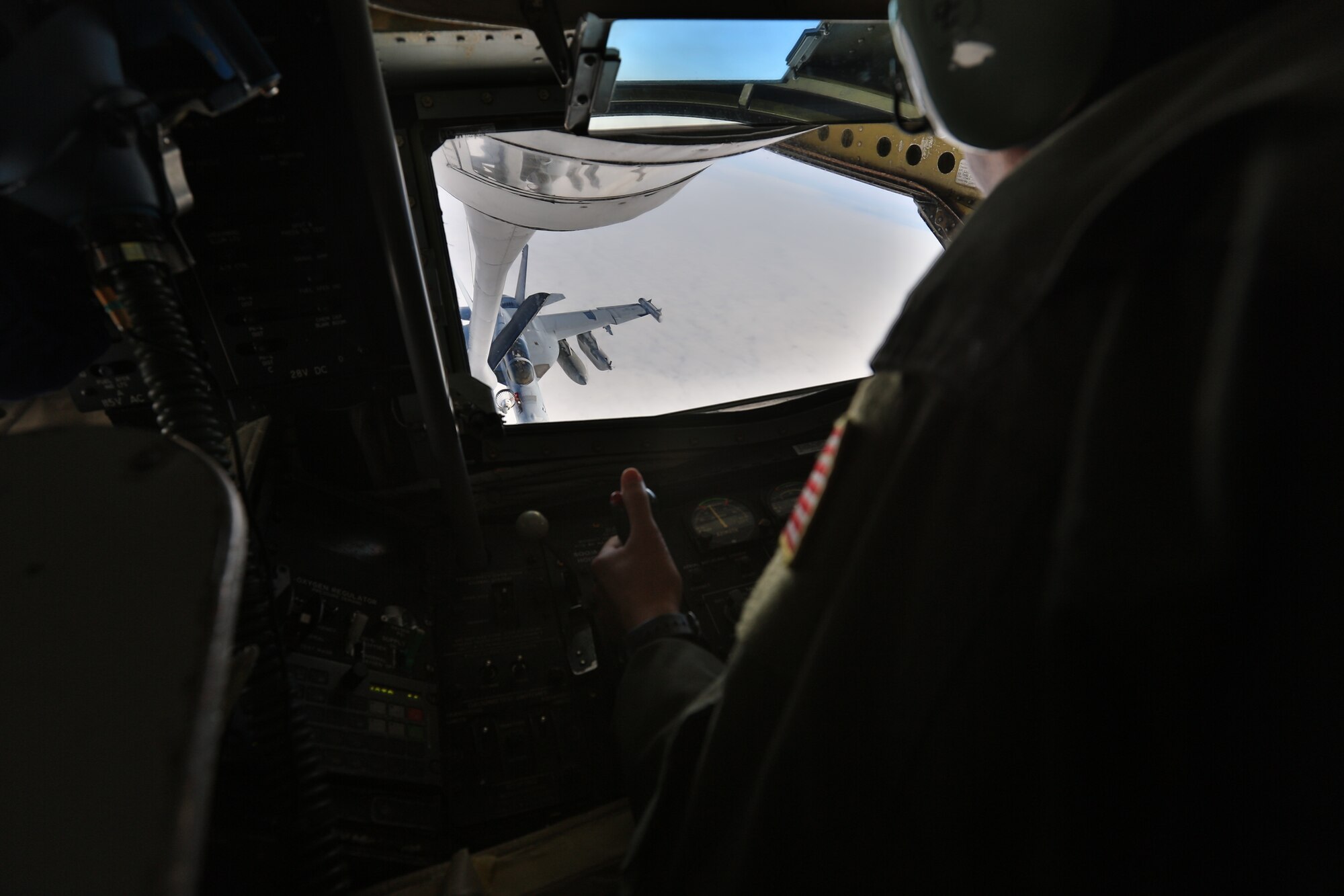 U.S. Air Force Tech Sgt. Erica Knight, 459th Air Refueling Wing, Andrews Air Force Base, Md., Air Force Reserve, aerial refueling technician, operates the refueling boom on a U.S. Air Force KC-135R Stratotanker aircraft while refueling a U.S. Navy EA-18G Growler aircraft, assigned to Electronic Attack Squadron 132, Electronic Attack Wing, U.S. Pacific Fleet, over the Gulf of Alaska, June 22, 2015. The aerial refueling was part of a training mission during Exercise Northern Edge 15. Northern Edge is Alaska’s premier joint training exercise designed to practice operations, techniques and procedures as well as enhance interoperability among the services. Thousands of Airmen, Soldiers, Sailors, Marines and Coast Guardsmen from active duty, reserve and National Guard units are involved. (U.S. Marine Corps photo by Staff Sgt. Jeffrey D. Anderson/ Released)