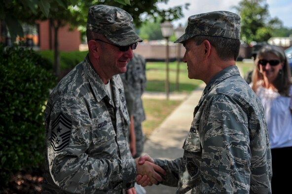 Chief Master Sgt. Jeffrey Craver, 4th Fighter Wing command chief, welcomes Maj. Gen. H. D. Polumbo Jr., Ninth Air Force commander, upon his arrival at Seymour Johnson Air Force Base, North Carolina, June 18, 2015. Polumbo visited the base to meet with Airmen from various squadrons, get an update on the wing’s “Make it Better” program, and talk with F-15E Strike Eagle aircrew about ongoing concerns. (U.S. Air Force photo by Senior Airman Brittain Crolley/Released)