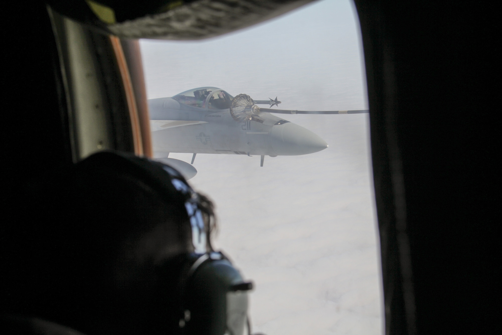 A U.S. Navy F/A-18E Super Hornet takes fuel from a U.S. Marine Corps KC-130J stationed in Iwakuni, Japan over the Gulf of Alaska while participating in Exercise Northern Edge June 22, 2015. Over 200 military aircraft from all services practiced operations, techniques and procedures while simultaneously enhancing interoperability during Exercise Northern Edge 2015 – Alaska’s premier joint training exercise. (U.S. Navy photo by Lt. Edward Cartagena)