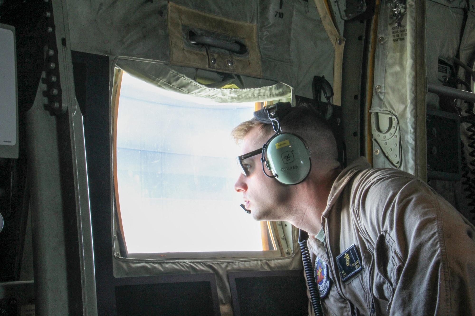 U.S. Marine LCpl. K. Dillard of VMGR-152 from Iwakuni, Japan observes refueling of a U.S. Navy F/A-18F Super Hornet aboard a U.S. Marine Corps KC-130J over the Gulf of Alaska in support of Exercise Northern Edge June 22, 2015. Over 200 military aircraft from all services practiced operations, techniques and procedures while simultaneously enhancing interoperability during Exercise Northern Edge 2015 – Alaska’s premier joint training exercise. (U.S. Navy photo by Lt. Edward Cartagena)