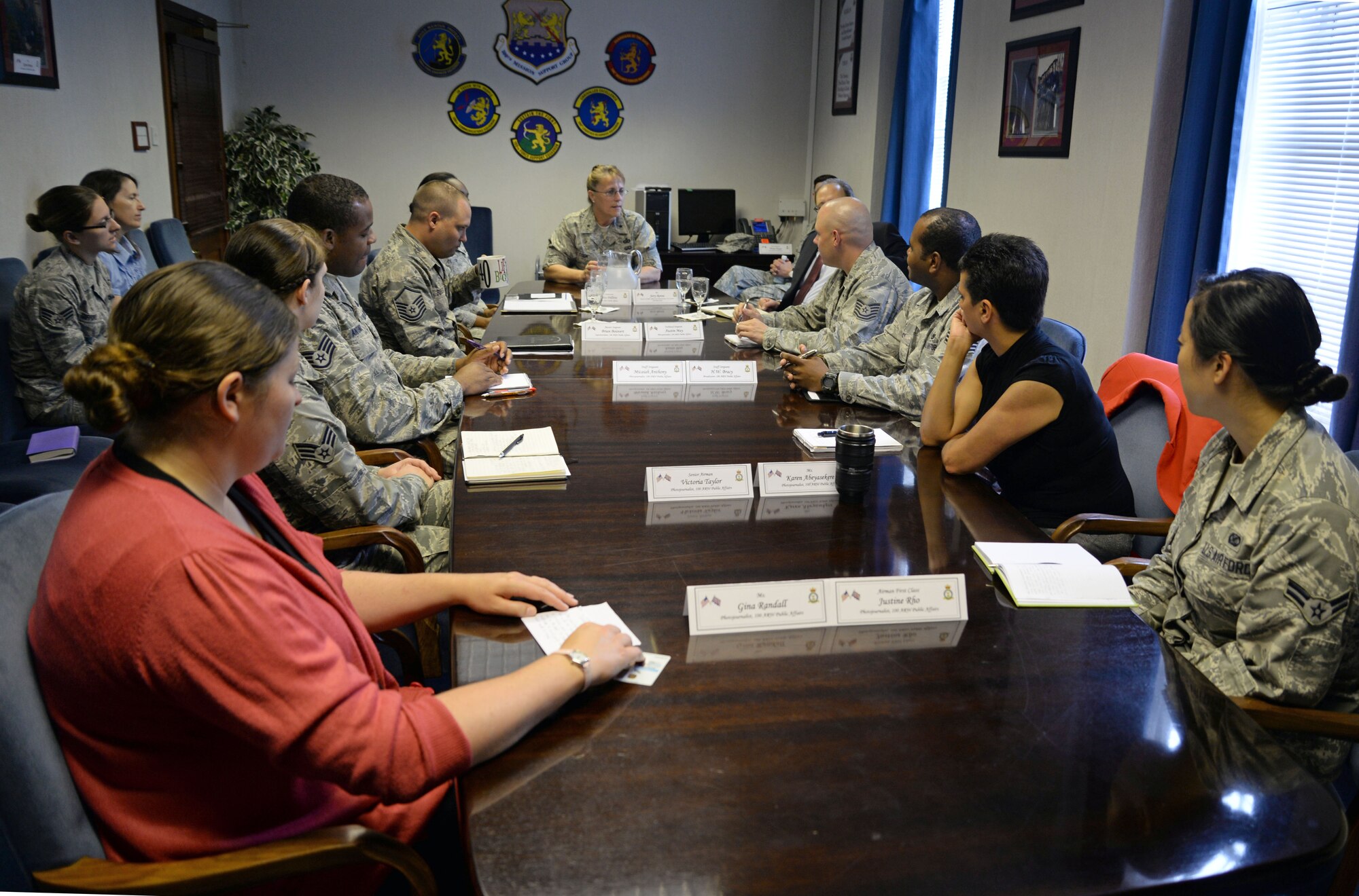 U.S. Air Force Brig. Gen. Kathleen A. Cook, center, Director of Public Affairs, Office of the Secretary of the Air Force, the Pentagon, Washington, D.C., speaks with Public Affairs Airmen during a meet and greet session June 24, 2015, on RAF Mildenhall, England. Cook and Jerry Renne, Director of Public Affairs and Communication, Headquarters, U.S. Air Forces in Europe, U.S. Air Forces Africa, visited Public Affairs offices in the local area to answer Airmen’s questions and concerns within their career field. (U.S. Air Force photo by Senior Airman Christine Halan/Released)