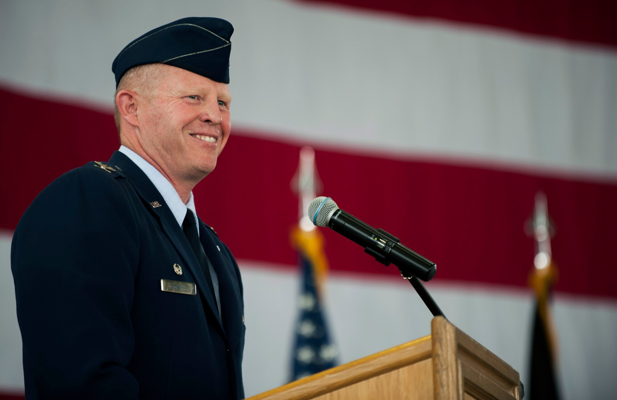 U.S. Air Force Col. Joe McFall, 52nd Fighter Wing commander, speaks during the 52nd Maintenance Group change of command ceremony in hangar one on Spangdahlem Air Base, Germany, June 18, 2015. The change of command is a military tradition that represents a formal transfer of authority and responsibility for a unit from one leader to another. (U.S. Air Force photo by Airman 1st Class Timothy Kim/Released)