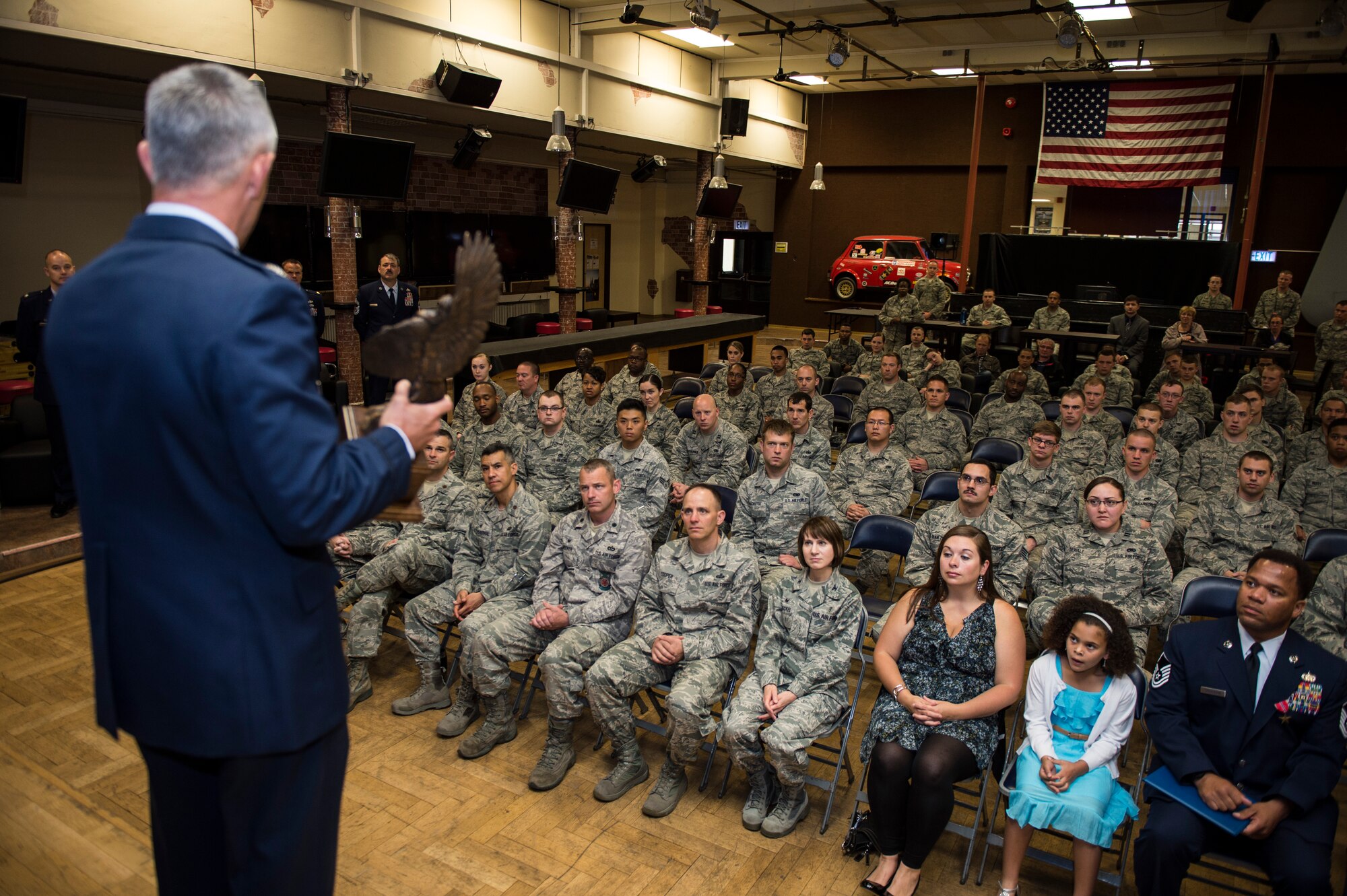 U.S. Air Force Col. Tod R. Fingal, U.S. Air Forces in Europe and Air Forces Africa deputy of operations, congratulates the 52nd Logistics Readiness Squadron for winning the 2014 Daedalian Logistics Readiness Award during a presentation at the Brick House on Spangdahlem Air Base, Germany, June 24, 2015. The Daedalian Logistics Readiness Award, presented annually to a logistics readiness squadron that has achieved the best supply effectiveness record in the U.S. Air Force in support of mission aircraft and weapons. (U.S. Air Force photo by Staff Sgt. Christopher Ruano/Released) 
