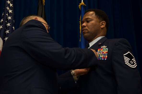 U.S. Air Force Master Sgt. Greer Stevenson, 52nd Fighter Wing Safety Office motorcycle safety program manager, receives the Bronze Star Medal from U.S. Air Force Col. Drysdale Hernandez, 52nd Mission Support Group commander during an award presentation at the Brick House on Spangdahlem Air Base, Germany, June 24, 2015. Stevenson received the award for his service during a 2014 deployment as a Class VII rolling stock logistics advisor in support of Operation Enduring Freedom. (U.S. Air Force photo by Staff Sgt. Christopher Ruano/Released)