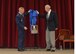 Lt. Gen. Steven Kwast, Air University commander, and retired Gen. Thomas C. Richards, former deputy commander in chief, Headquarters U.S. European Command, Stuttgart-Vaihingen, West Germany, unveil a plaque in honor of Richards being inducted into the Air Force Reserve Officer Training Corps Distinguished Alumni Program.   Richards received the award for his contributions to the United States Air Force spanning four decades.  He received his commission as a distinguished graduate of the Air Force ROTC program at Virginia Polytechnic Institute in 1956. (U.S. photo by Maj. Ann Graham/Cleared)