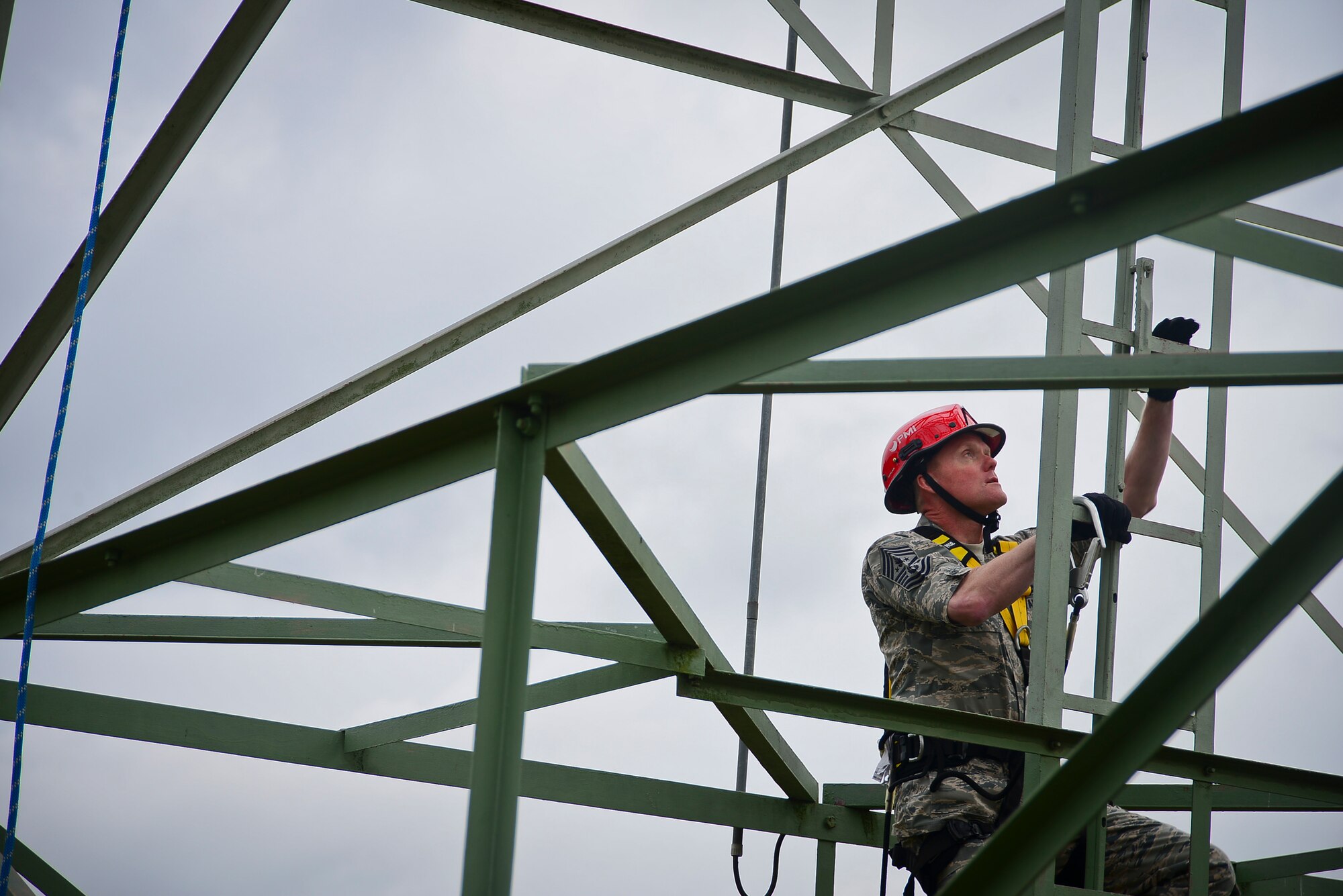 Chief Master Sgt. of the Air Force James A. Cody climbs an antenna tower June 22, 2015, on Ramstein Air Base, Germany. Cody performed a tower climb with Airmen from the 1st CMXS during his 435th Air Ground Operations Wing immersion tour.  (U.S. Air Force photo/Tech. Sgt. Daylena S. Ricks) 