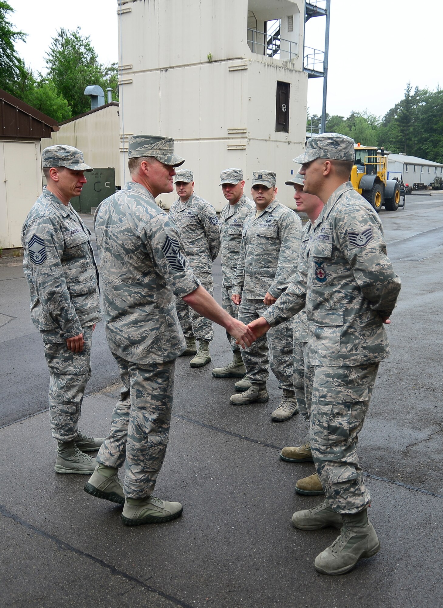 Chief Master Sgt. of the Air Force James A. Cody greets Airmen from the 435th Air Ground Operations Wing’s Construction and Training Squadron before receiving their mission brief June 22, 2013, on Ramstein Air Base, Germany.  Cody spoke with the Airmen and answered questions about current Air Force issues.  (U.S. Air Force photo/Tech. Sgt. Daylena S. Ricks)
