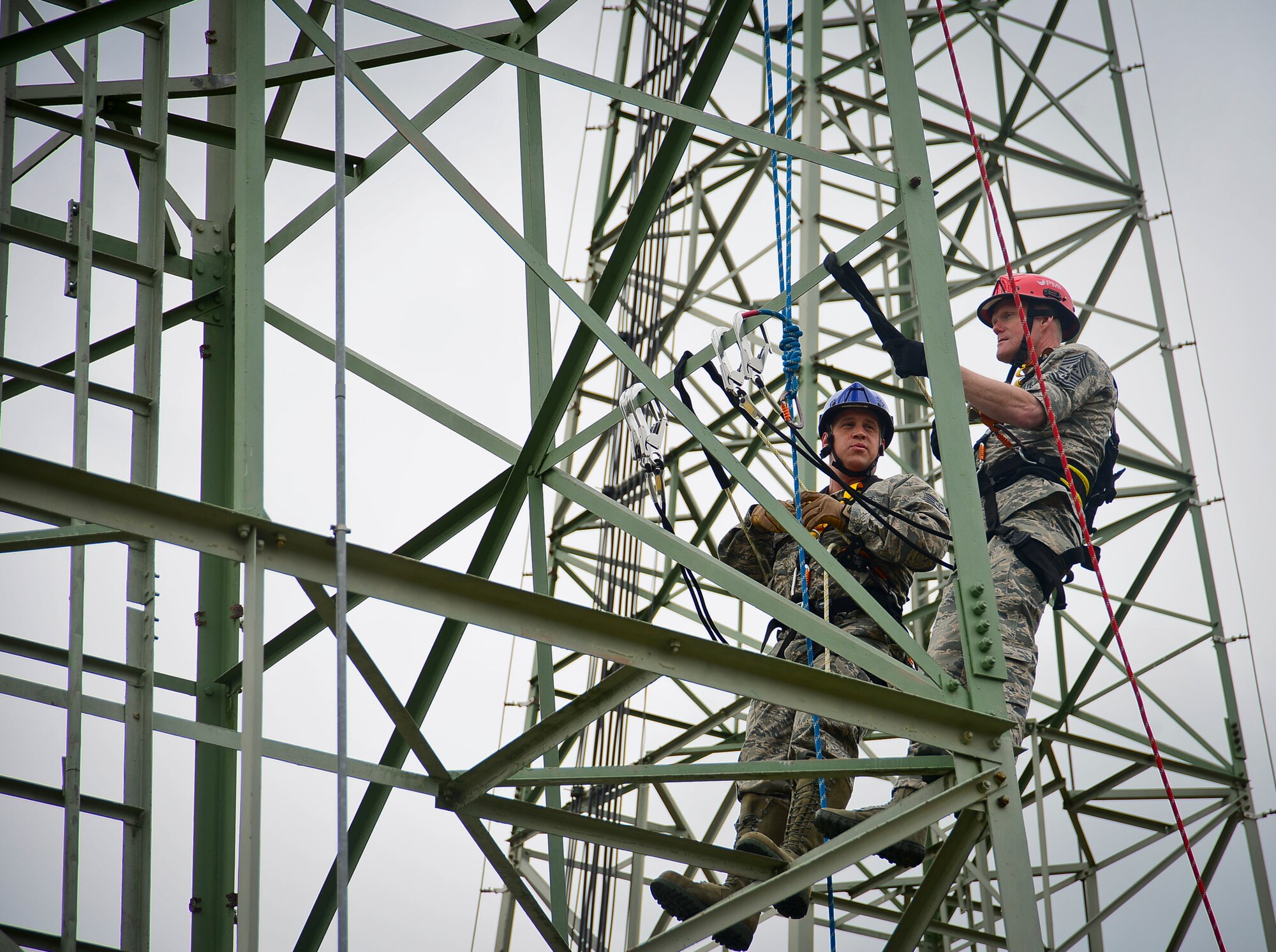 Chief Master Sgt. of the Air Force James A. Cody and Staff Sgt. Daniel Peters, 1st Communications Maintenance Squadron cable and antenna theater maintenance supervisor, climb an antenna tower together on Ramstein Air Base, Germany, June 22, 2015. Cody performed a tower climb with Airmen from 1st CMXS during his 435th Air Ground Operations Wing immersion tour.  (U.S. Air Force photo/Tech. Sgt. Daylena S. Ricks)