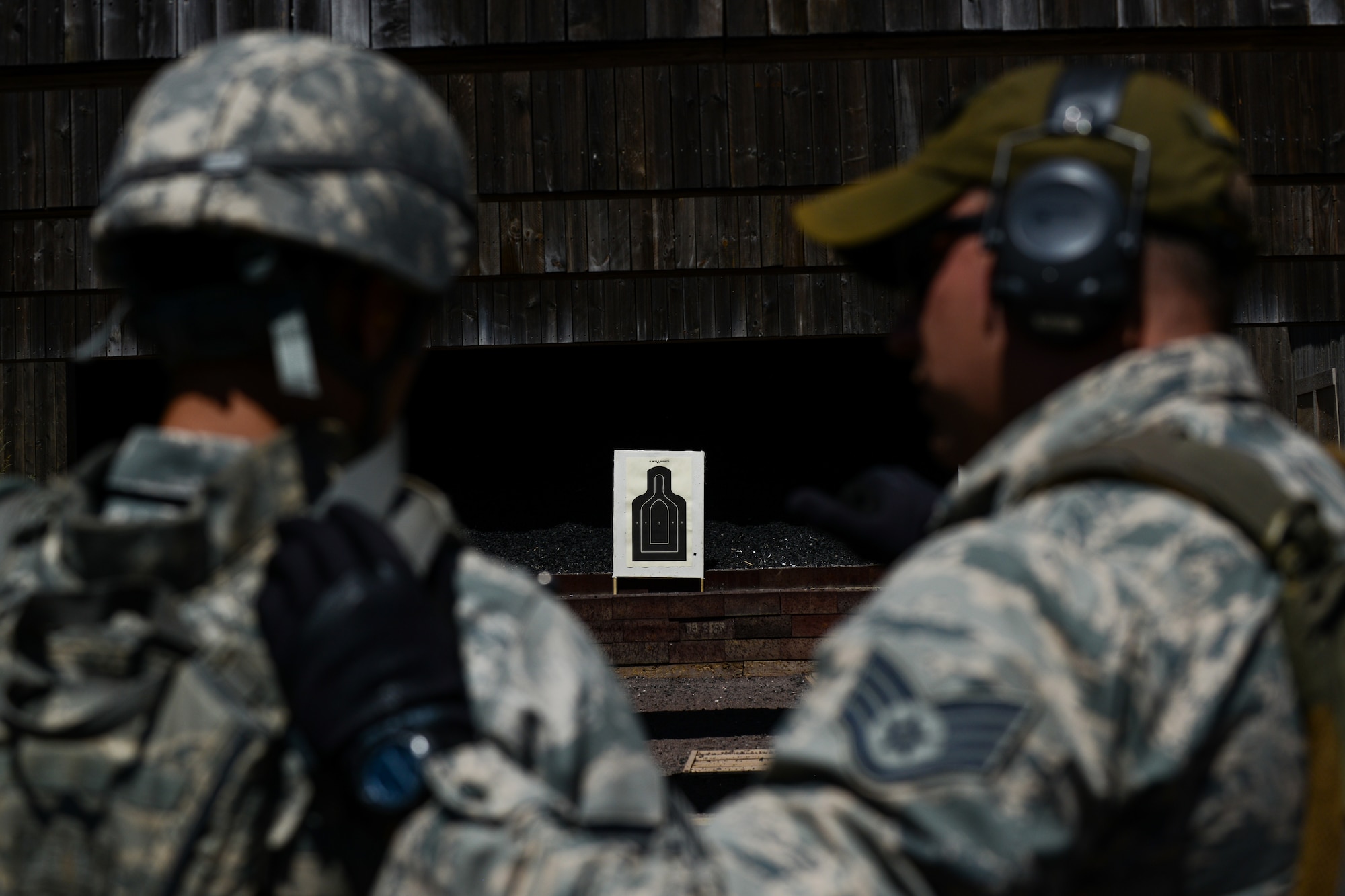 A Creek Defender instructor mentors a student during live-fire, stress-fire training June 17, 2015 on Baumholder, Germany.  Security forces members rely on thorough feedback from their instructors during training exercises to help improve marksmanship and tactics. (U.S. Air Force photo/Senior Airman Nicole Sikorski)