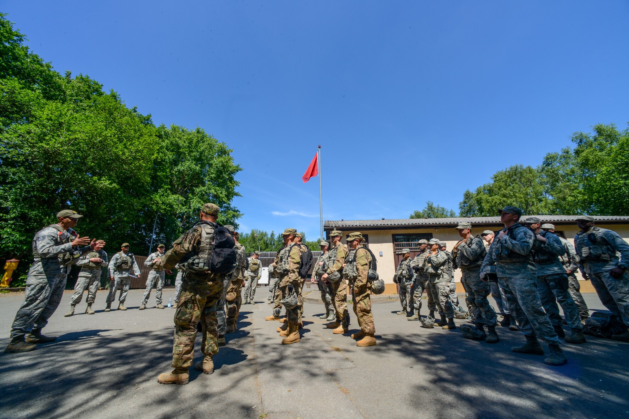 Security forces members wait to begin live-fire, stress-fire training June 17, 2015 on Baumholder, Germany. During this exercise, defenders fired weapons at different distances, performed physical exercise and then immediately fired again on the range.  (U.S. Air Force photo/Senior Airman Nicole Sikorski)