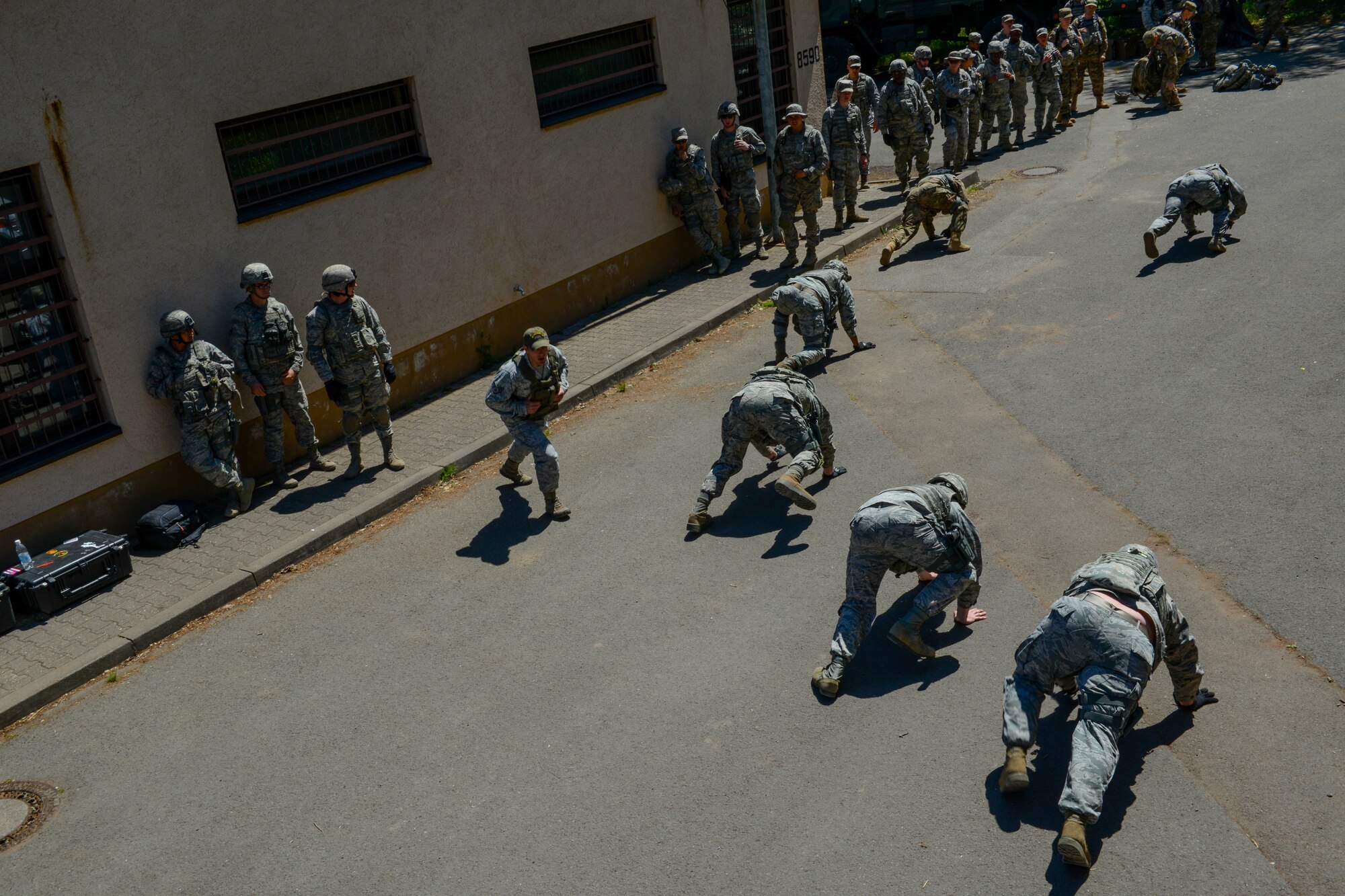 Security forces members from throughout U.S. Air Forces in Europe and Air Forces Africa perform bear crawls during live-fire, stress-fire training June 17, 2015, on Baumholder, Germany. The defenders performed extensive physical exercise after firing weapons to simulate physical and mental stress on a deployment.  (U.S. Air Force photo/Senior Airman Nicole Sikorski) 