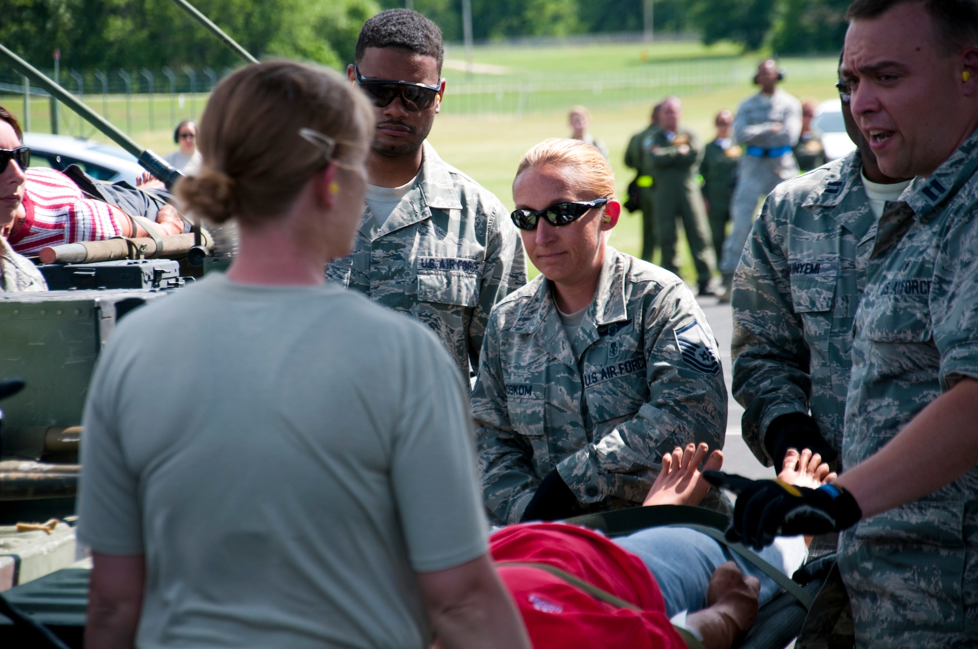 Members of the 446th Aeromedical Evacuation Squadron out of Joint Base Lewis-McChord, Wash., perform a patient on-load scenario during the Patriot Warrior exercise at Fort McCoy, Wis., June 21, 2015. Patriot Warrior is a joint exercise designed to demonstrate contingency deployment training ranging from bare base buildup to full operational capabilities. More than 6,000 members from the U.S. service branches and their Reserve components, including Air Force, Army, and Navy participated alongside British and Canadian forces. (U.S. Air Force Reserve photo by Senior Airman Daniel Liddicoet)