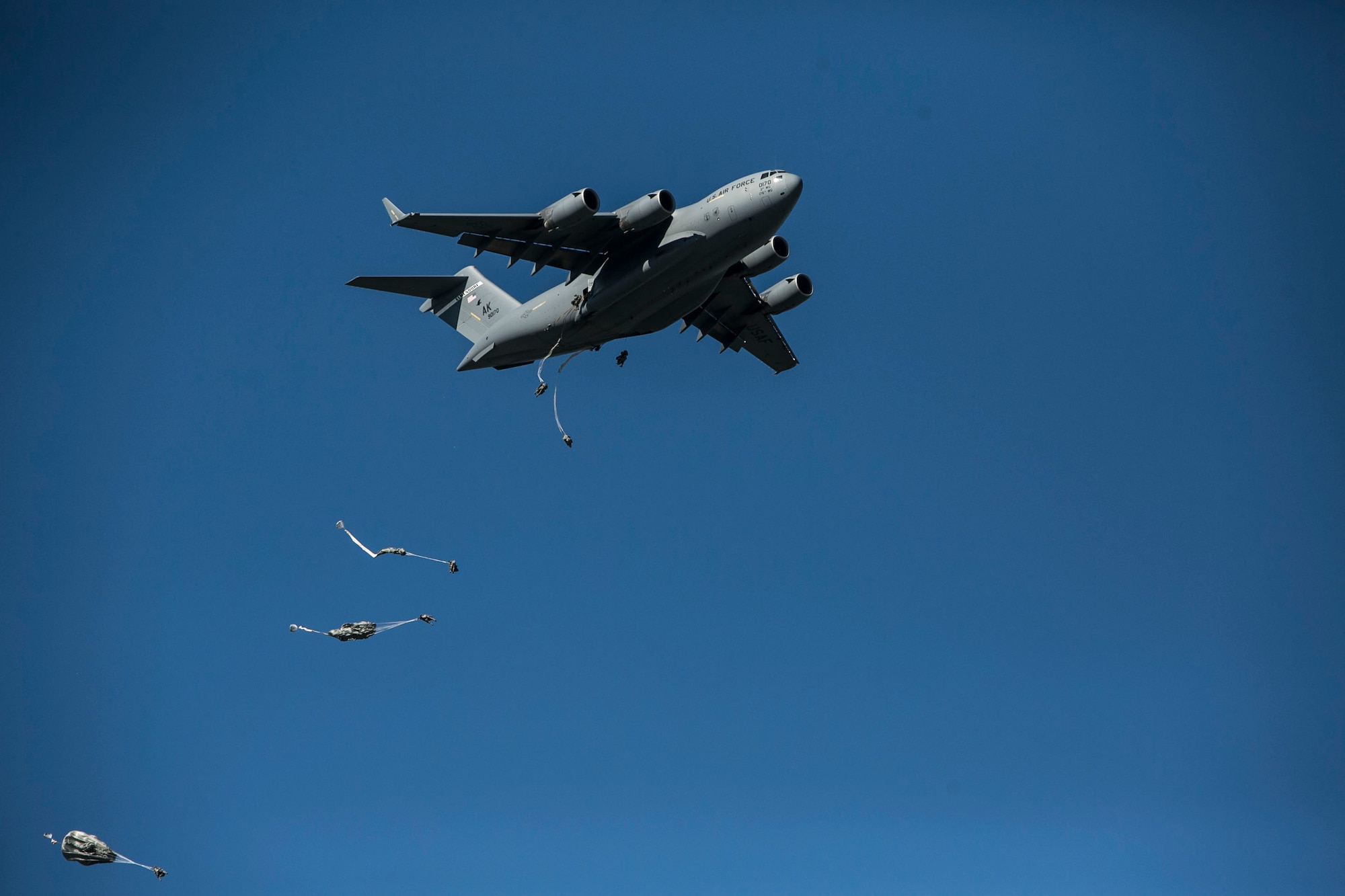 EIELSON AIR FORCE BASE, Alaska – U.S. Army engineers and combat engineers with the 6th Brigade Engineer Battalion, 4th Brigade Combat Team (Airborne), 25th Infantry Division, jump out of a U.S. Air Force C-17 Globemaster III aircraft into Allen Army Airfield at Fort Greely, Alaska, as part of Exercise Northern Edge, June 17, 2015. Northern Edge 2015 is Alaska’s premier joint training exercise designed to practice operations, techniques and procedures as well as enhance interoperability among the services. Thousands Airmen, Soldiers, Sailors, Marines and Coast Guardsmen from active duty, reserve and National Guard units are involved.  (U.S. Marine Corps photo by Cpl. Tyler S. Giguere/Released)