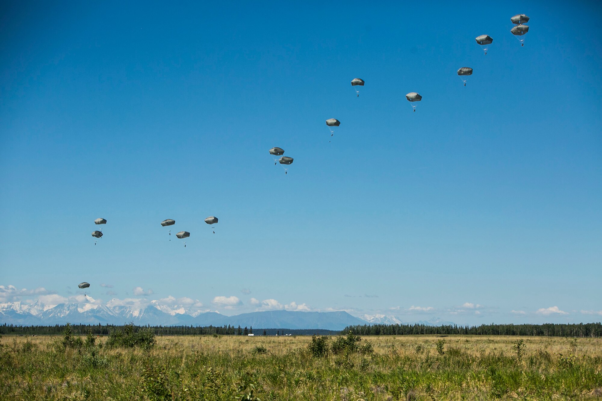 EIELSON AIR FORCE BASE, Alaska – Engineers and combat engineers with the 6th Brigade Engineer Battalion, 4th Brigade Combat Team (Airborne), 25th Infantry Division, parachute into Allen Army Airfield at Fort Greely, Alaska, as part of Exercise Northern Edge, June 17, 2015. Northern Edge 2015 is Alaska’s premier joint training exercise designed to practice operations, techniques and procedures as well as enhance interoperability among the services. Thousands Airmen, Soldiers, Sailors, Marines and Coast Guardsmen from active duty, reserve and National Guard units are involved. (U.S. Marine Corps photo by Cpl. Tyler S. Giguere/Released)